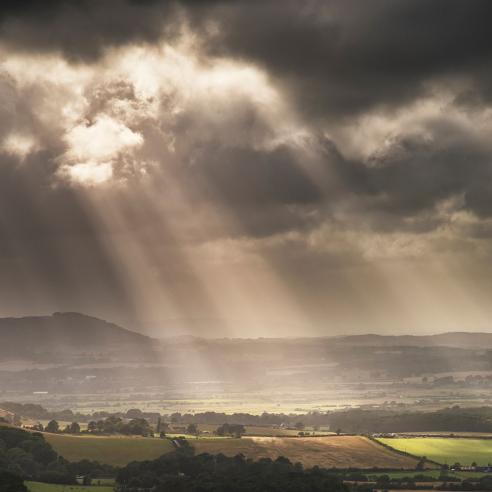 Storms clouds with sun rays